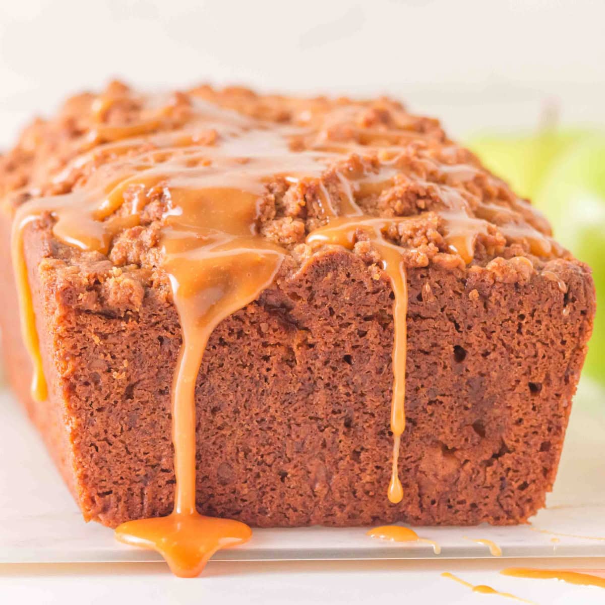 Caramel Apple Cake with caramel dripping.