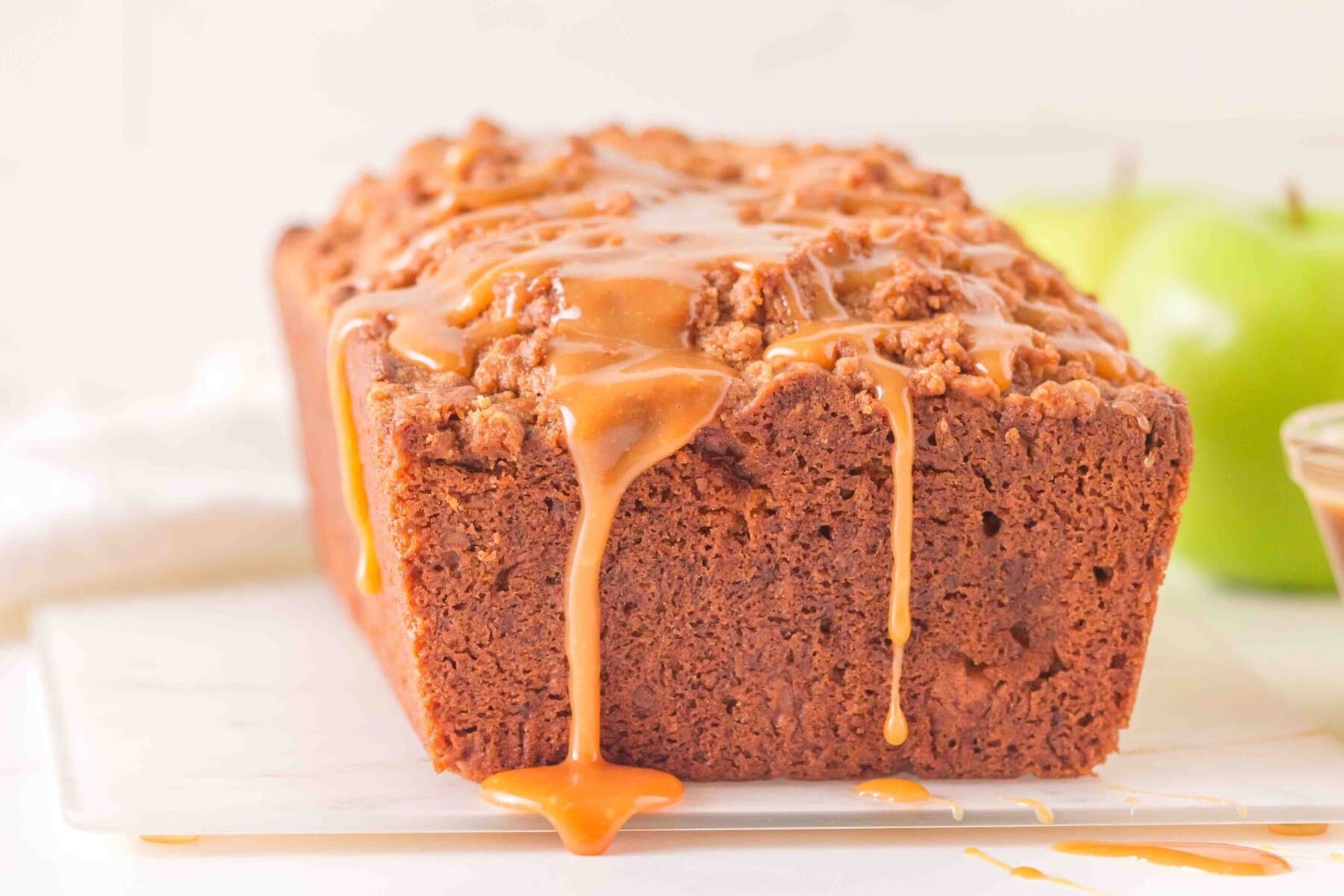 Front view of caramel dripping off cake.