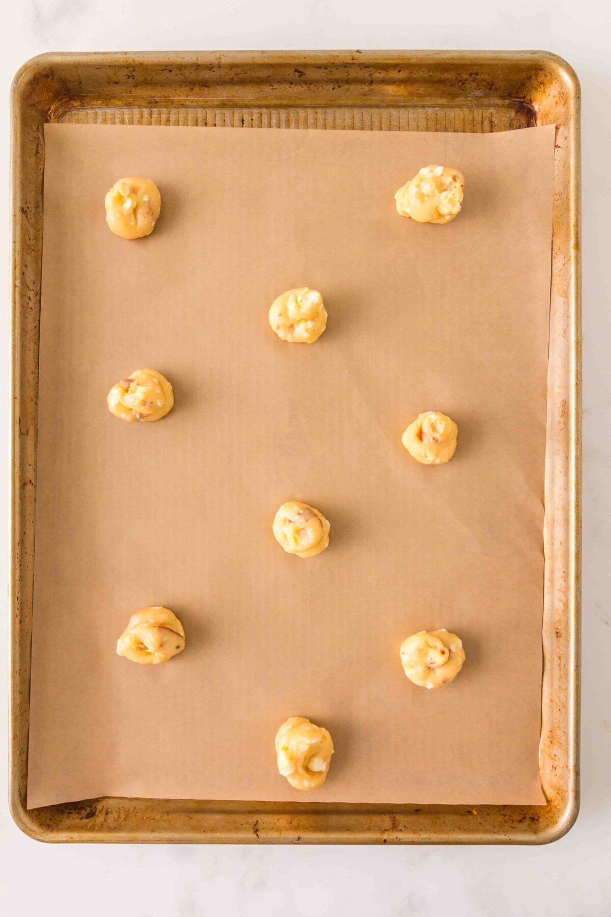 Dough piped onto a baking sheet. 
