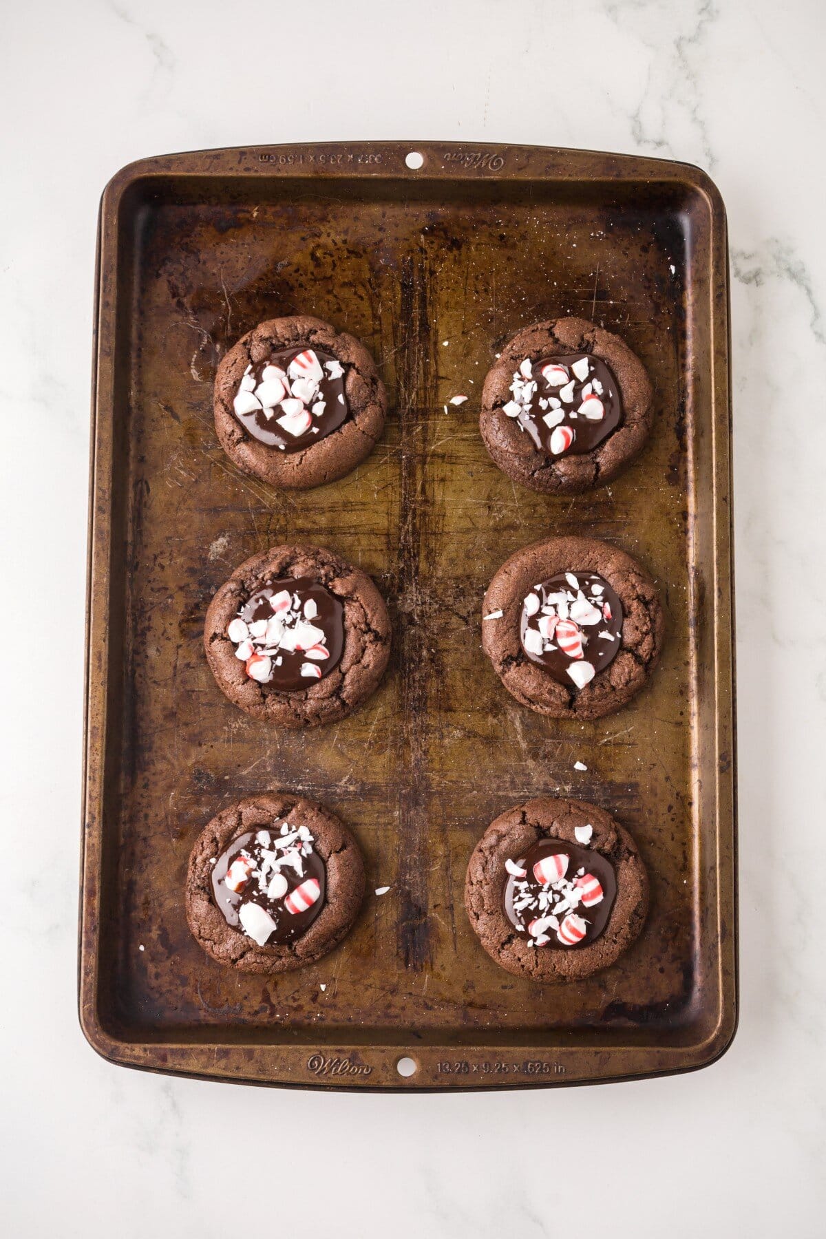 Finished cookies on a baking sheet.