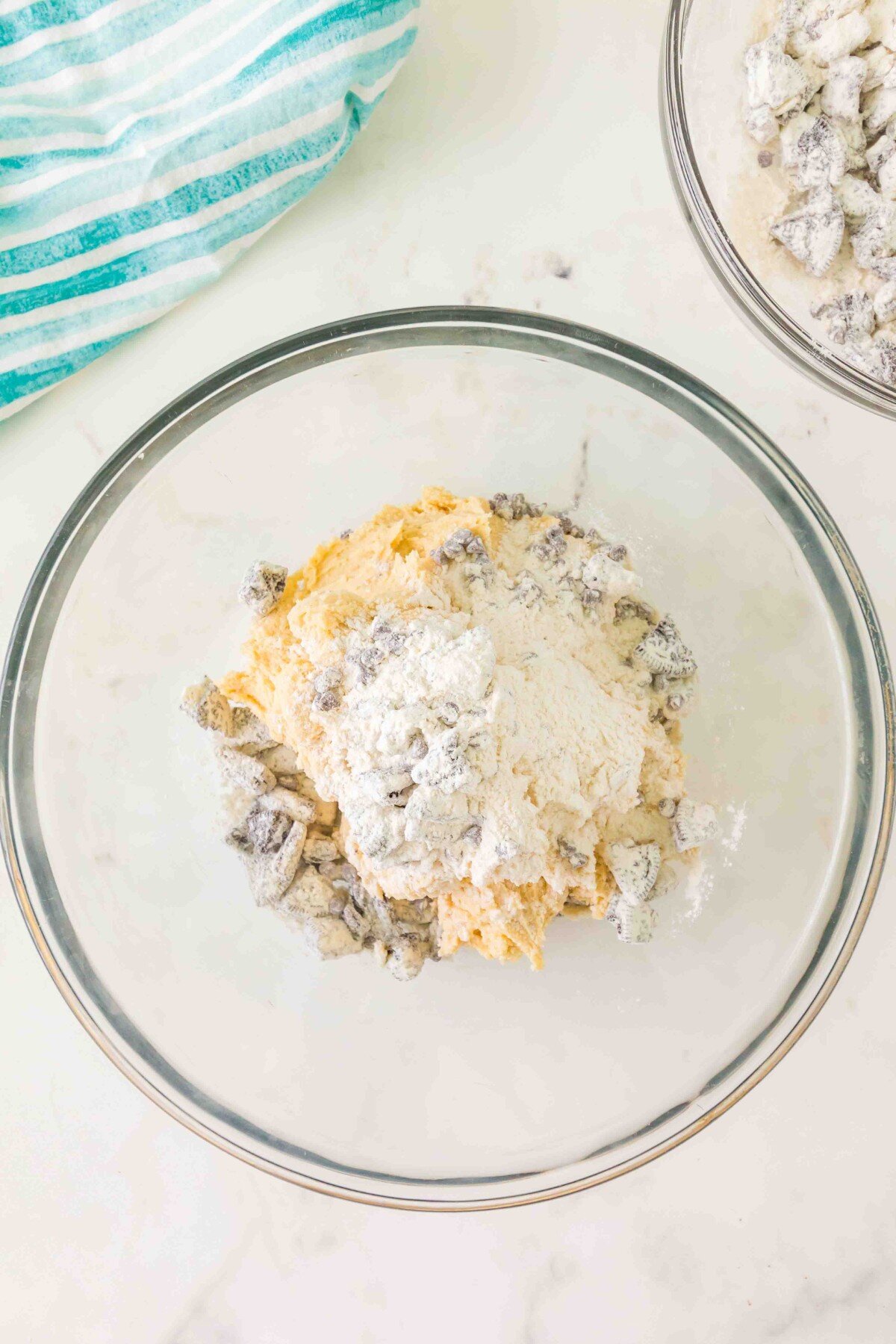 Mixing in the Oreo mixture. 