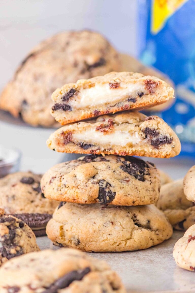 Oreo Cheesecake Cookies cut in half and stacked.