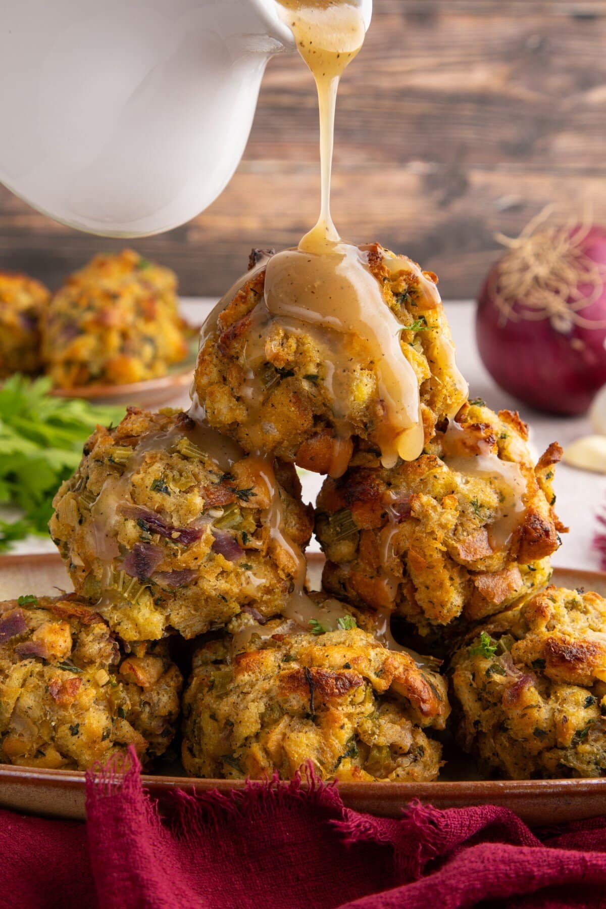 Stuffing balls piled high with gravy drizzled on.