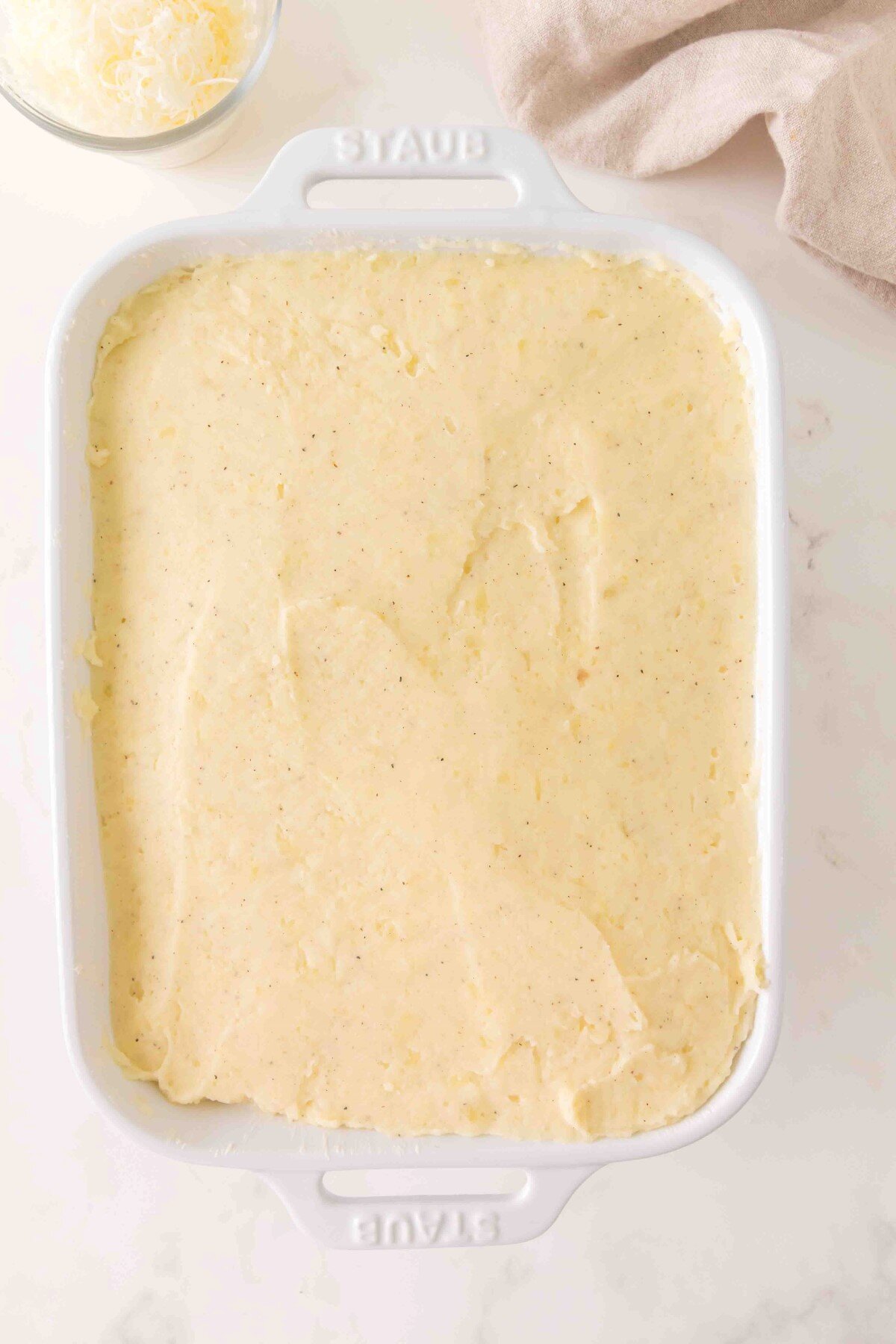 Potato mixture in baking pan.