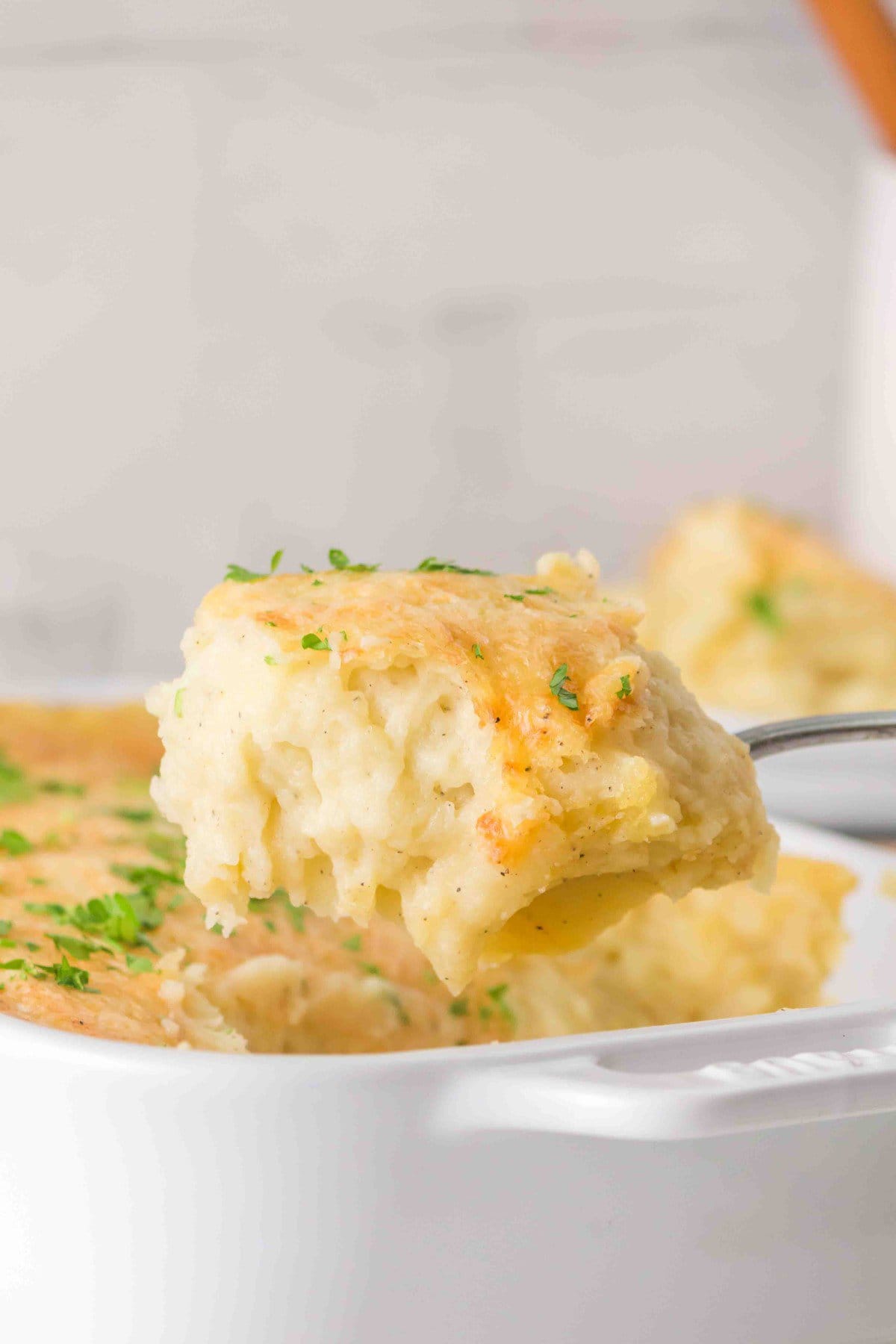 Spooning it out of the casserole dish.