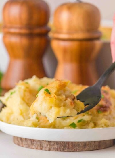 Taking a forkful of potatoes.