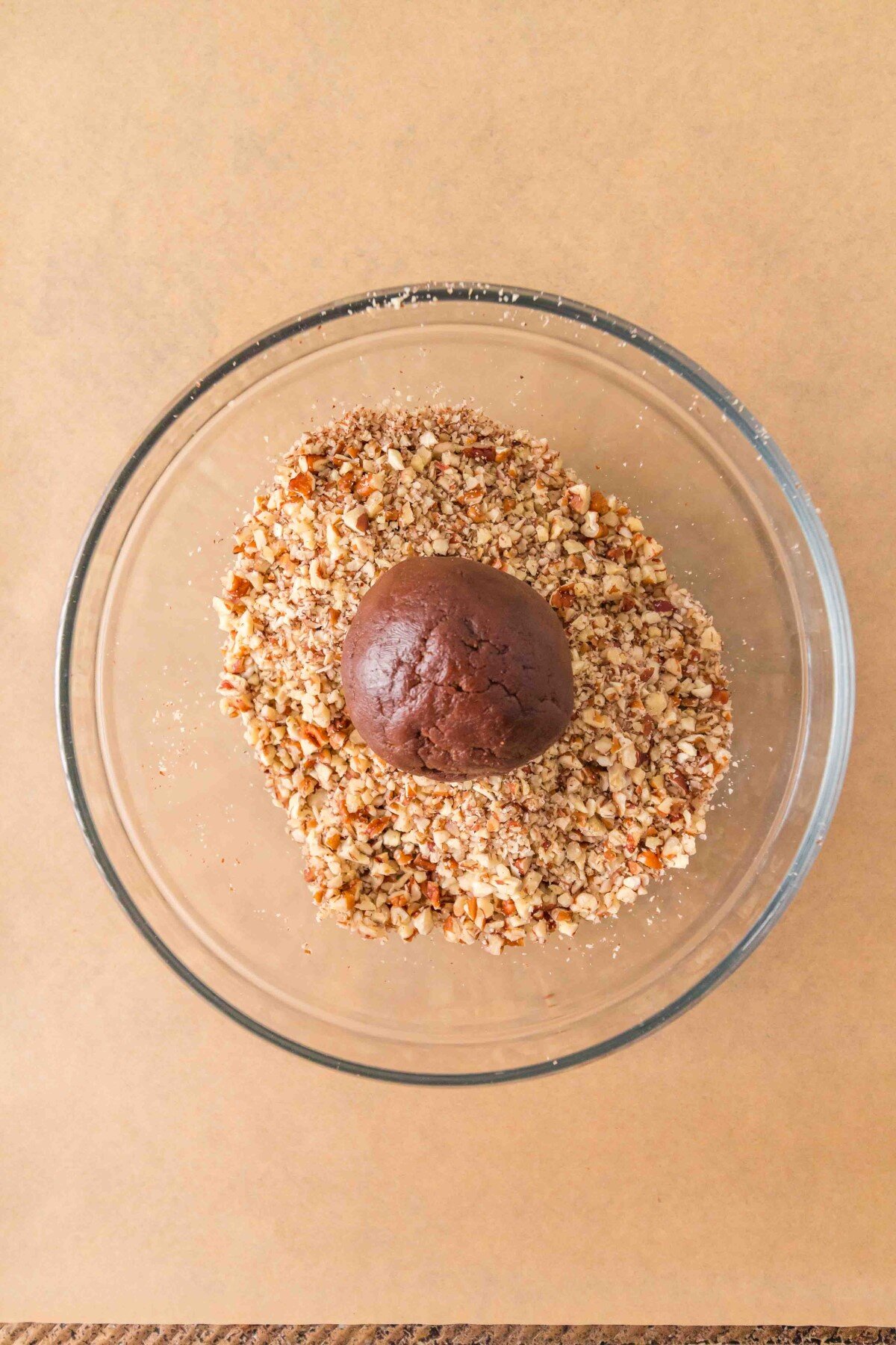 Rolling cookies in nuts.