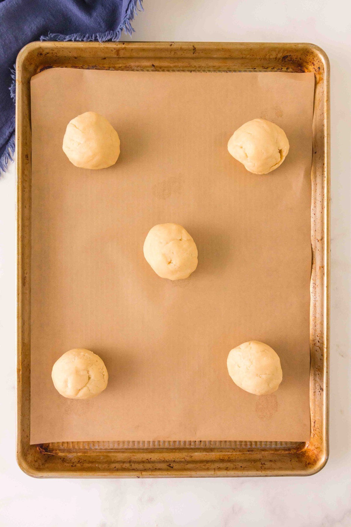 Dough balls on cookie sheet.