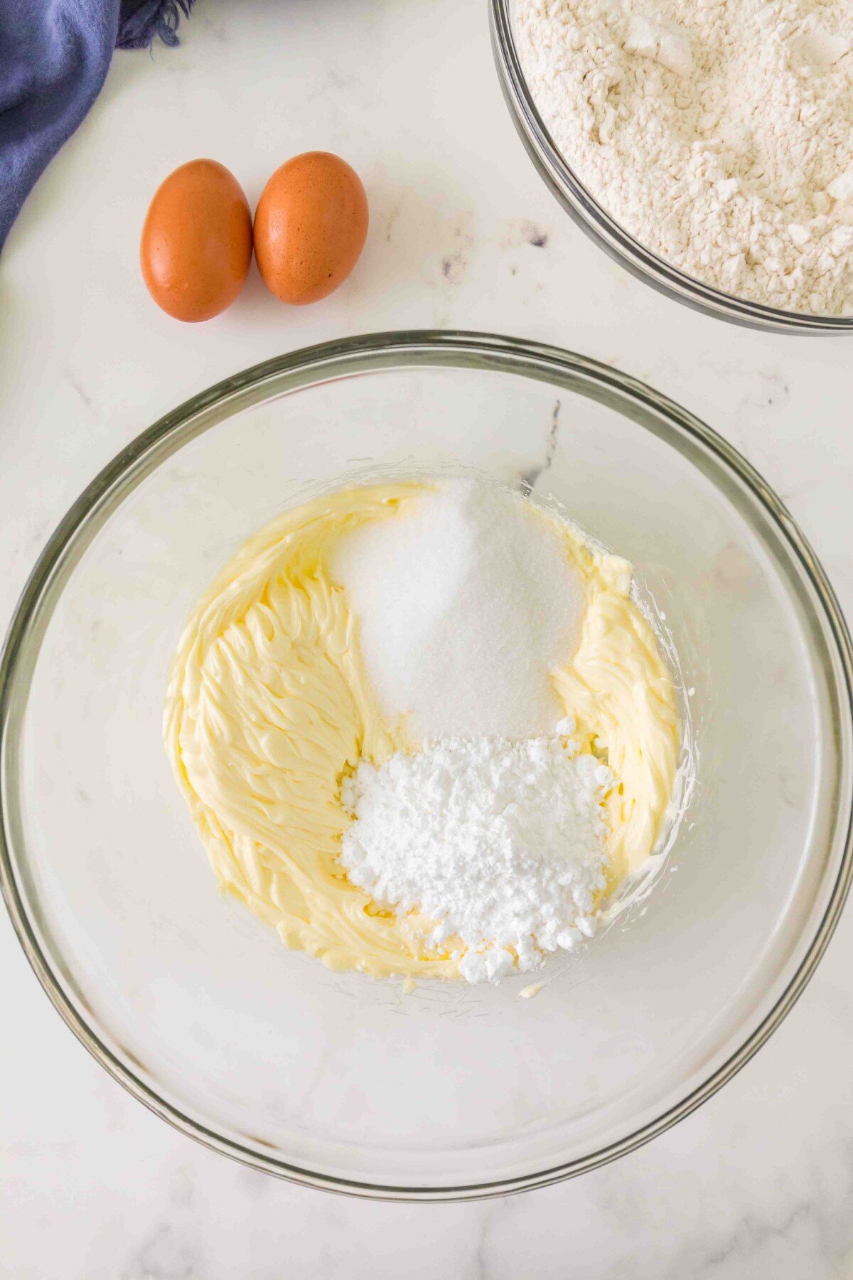 Butter creamed then sugars added.