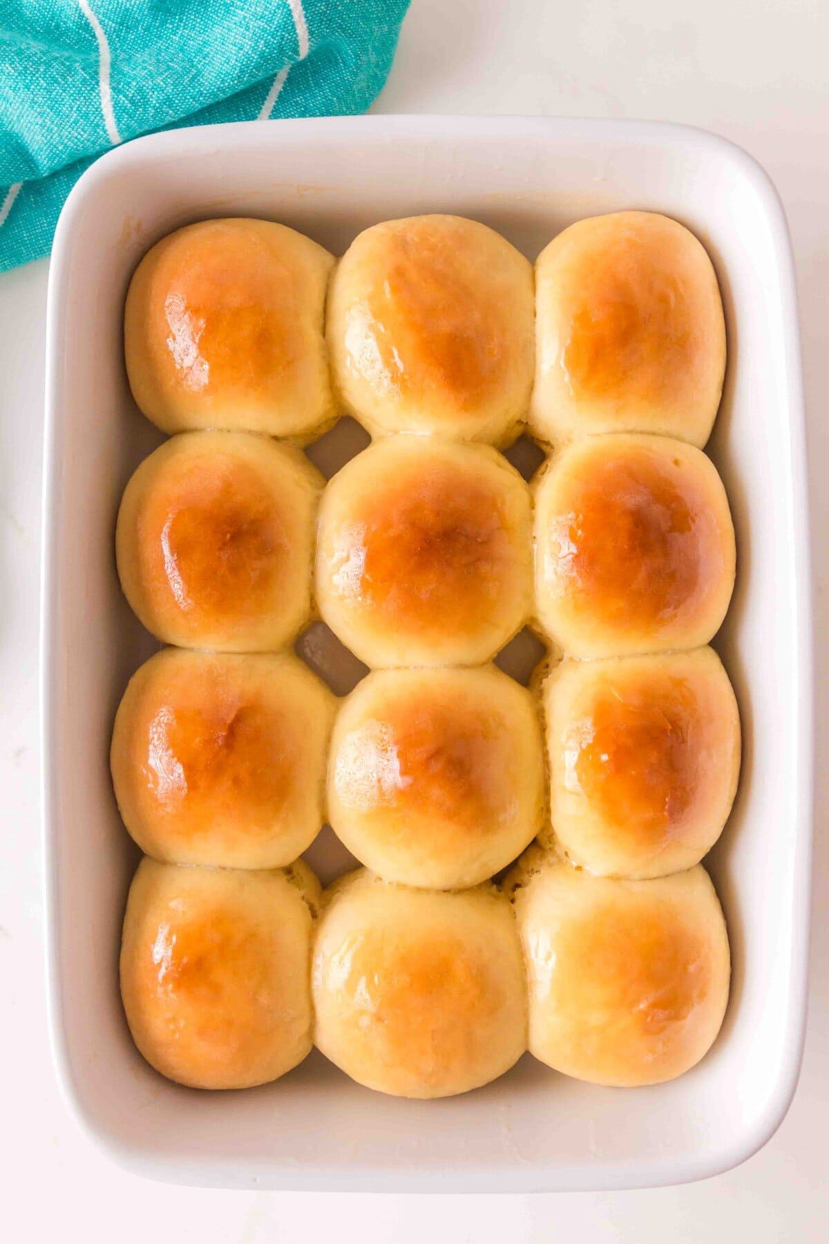Baked rolls gleaming with butter. 