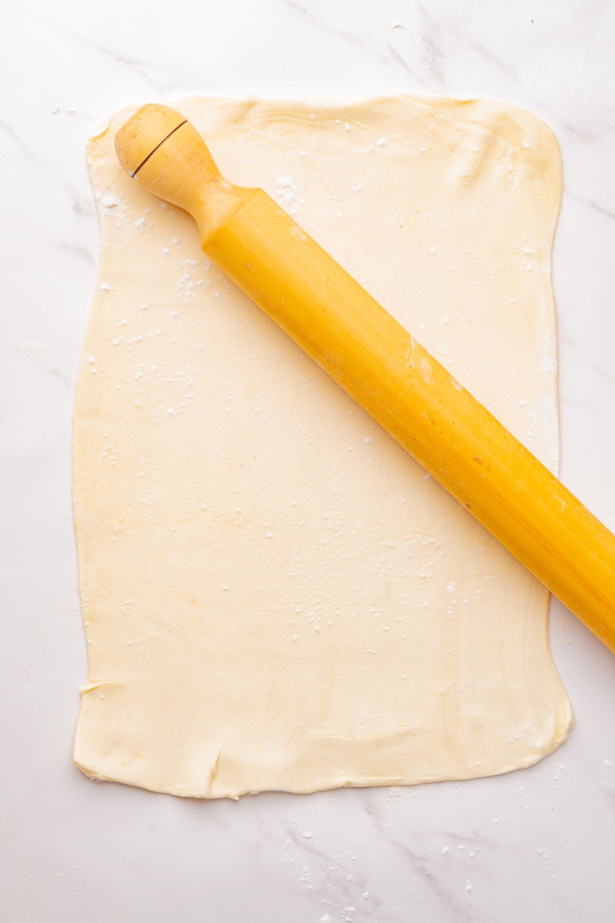 Rolling out puff pastry.