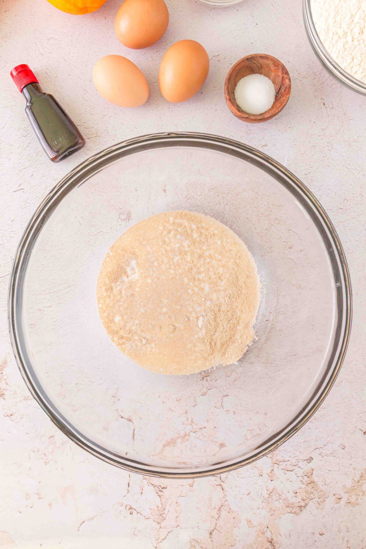 Yeast and milk in bowl. 