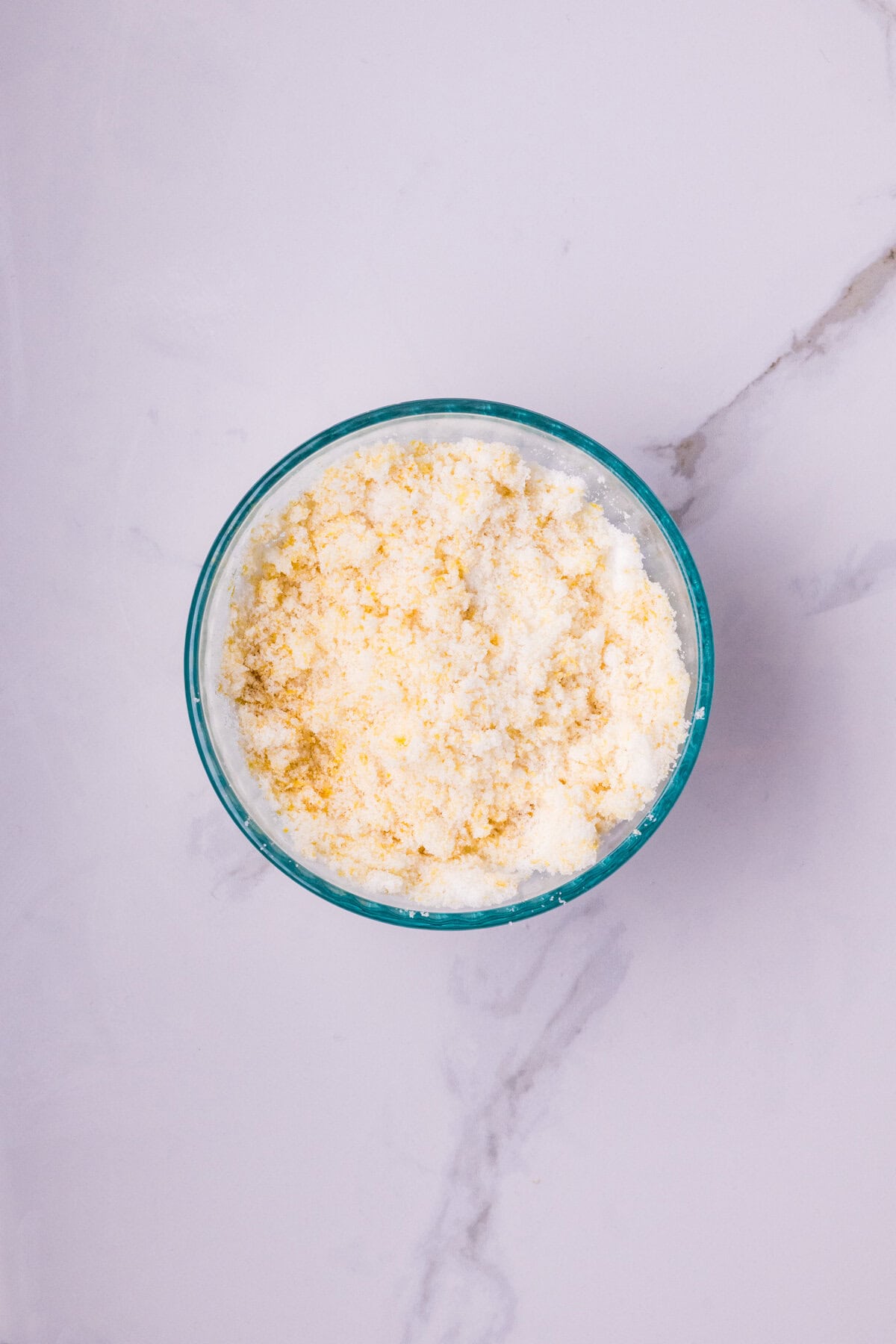 Sugar and lemon zest rubbed together.