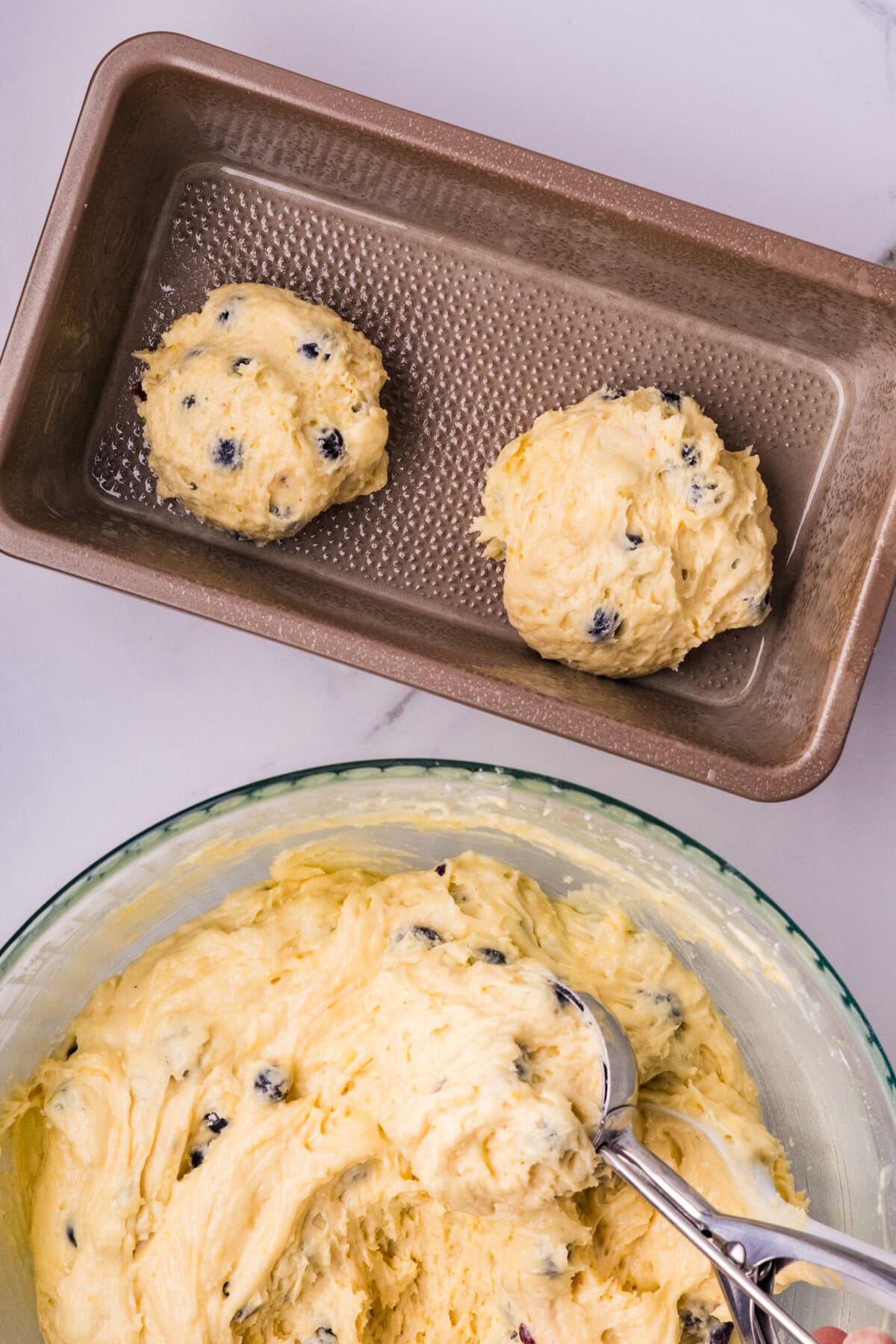 Spooning the batter into the prepared pan.