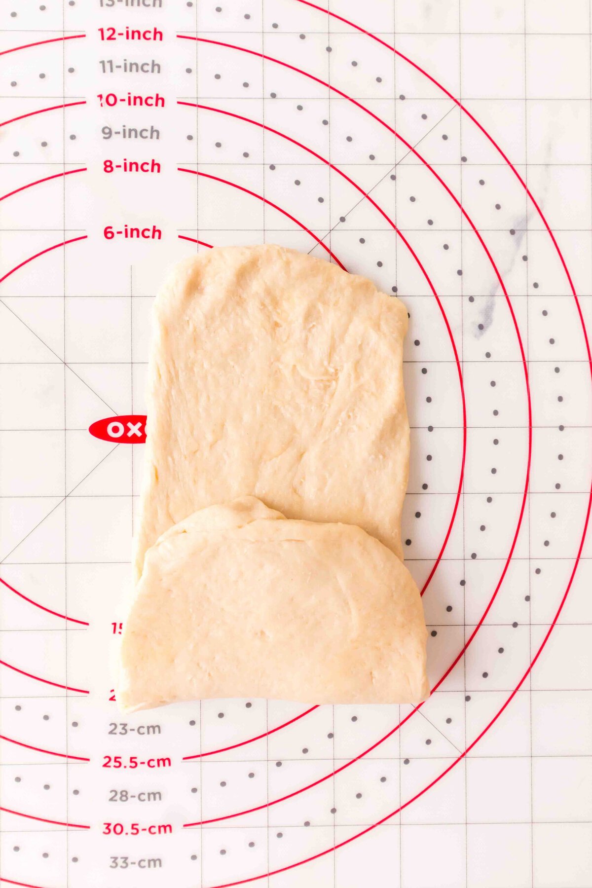 Dough folded in on one side to one third. 