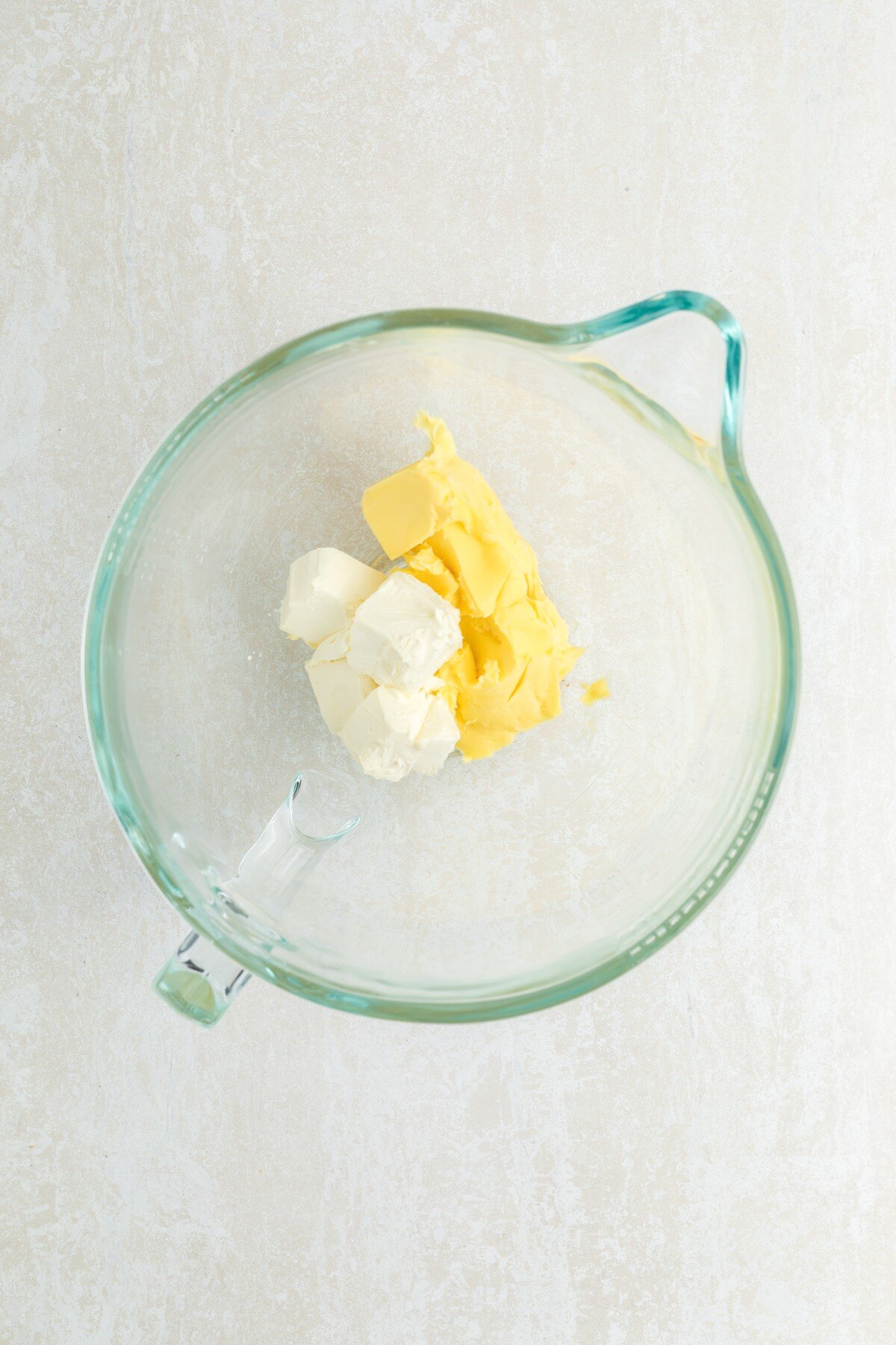 Cream cheese and butter in bowl.