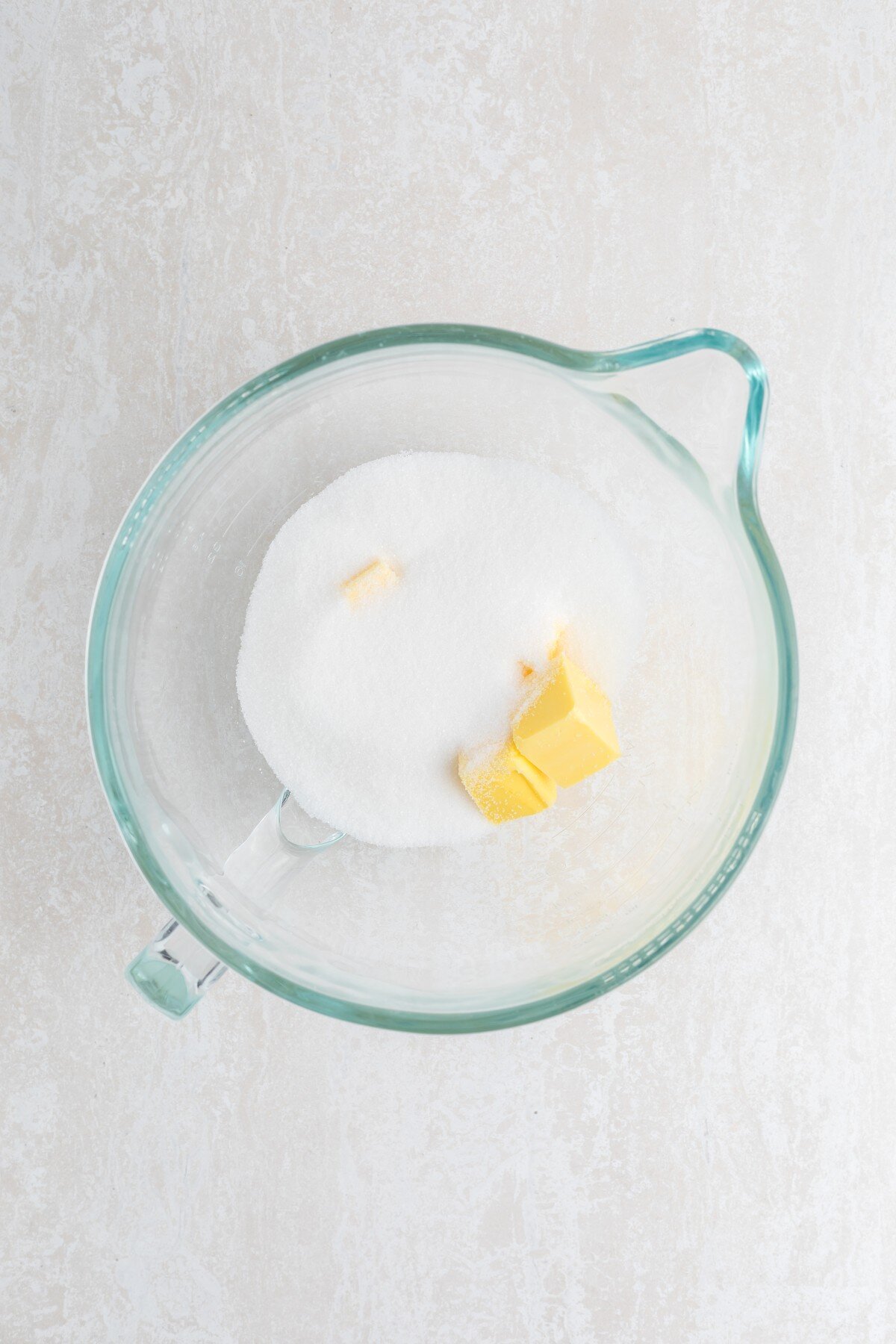 Sugar and butter in a bowl.
