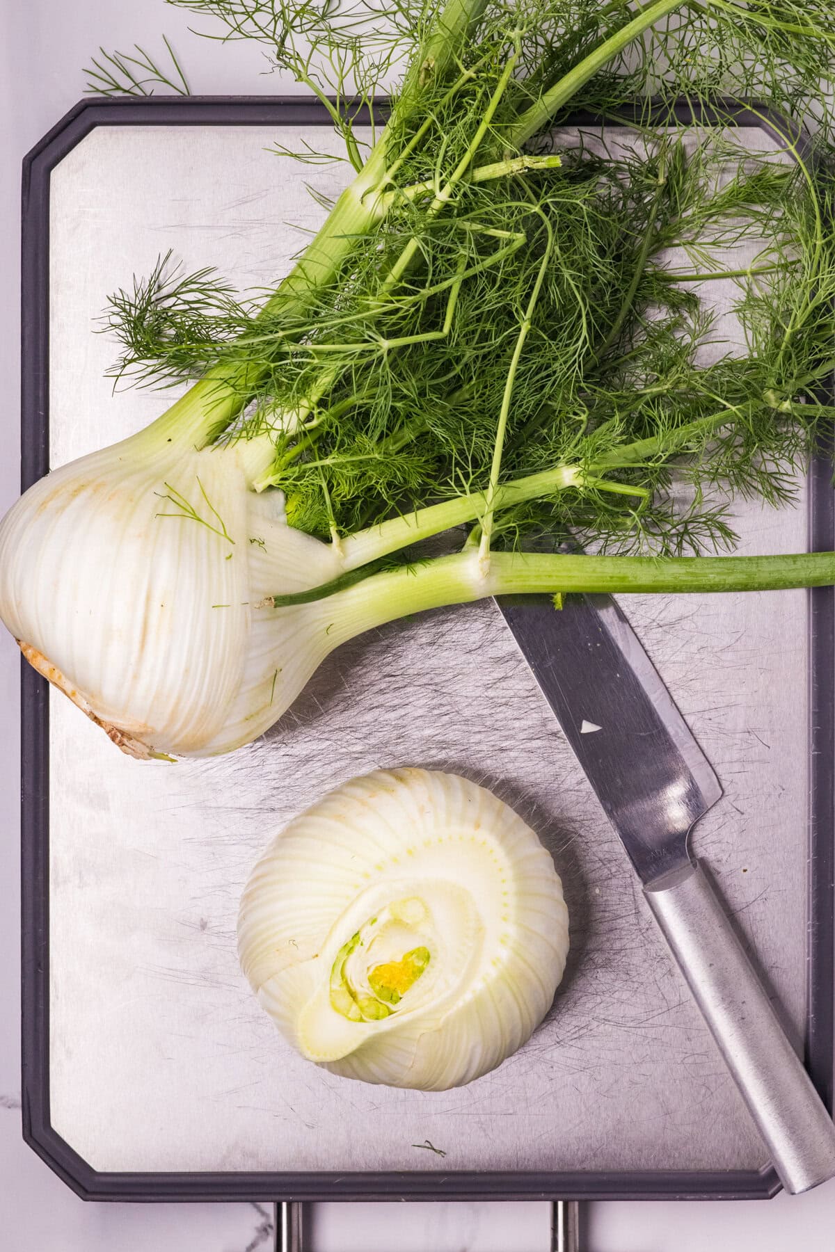 Cleaning a fennel bulb. 