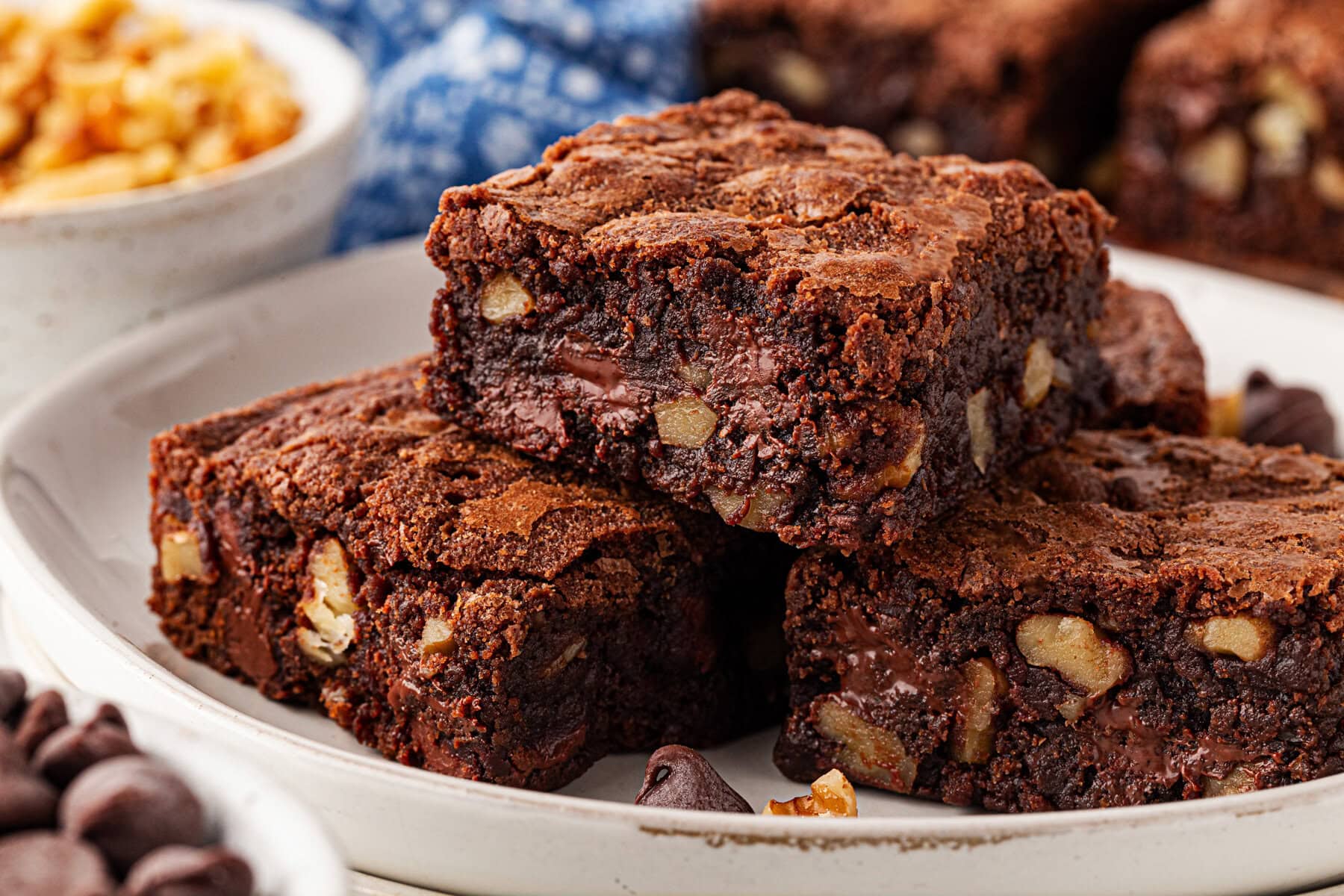 Brownies stacked on a plate.