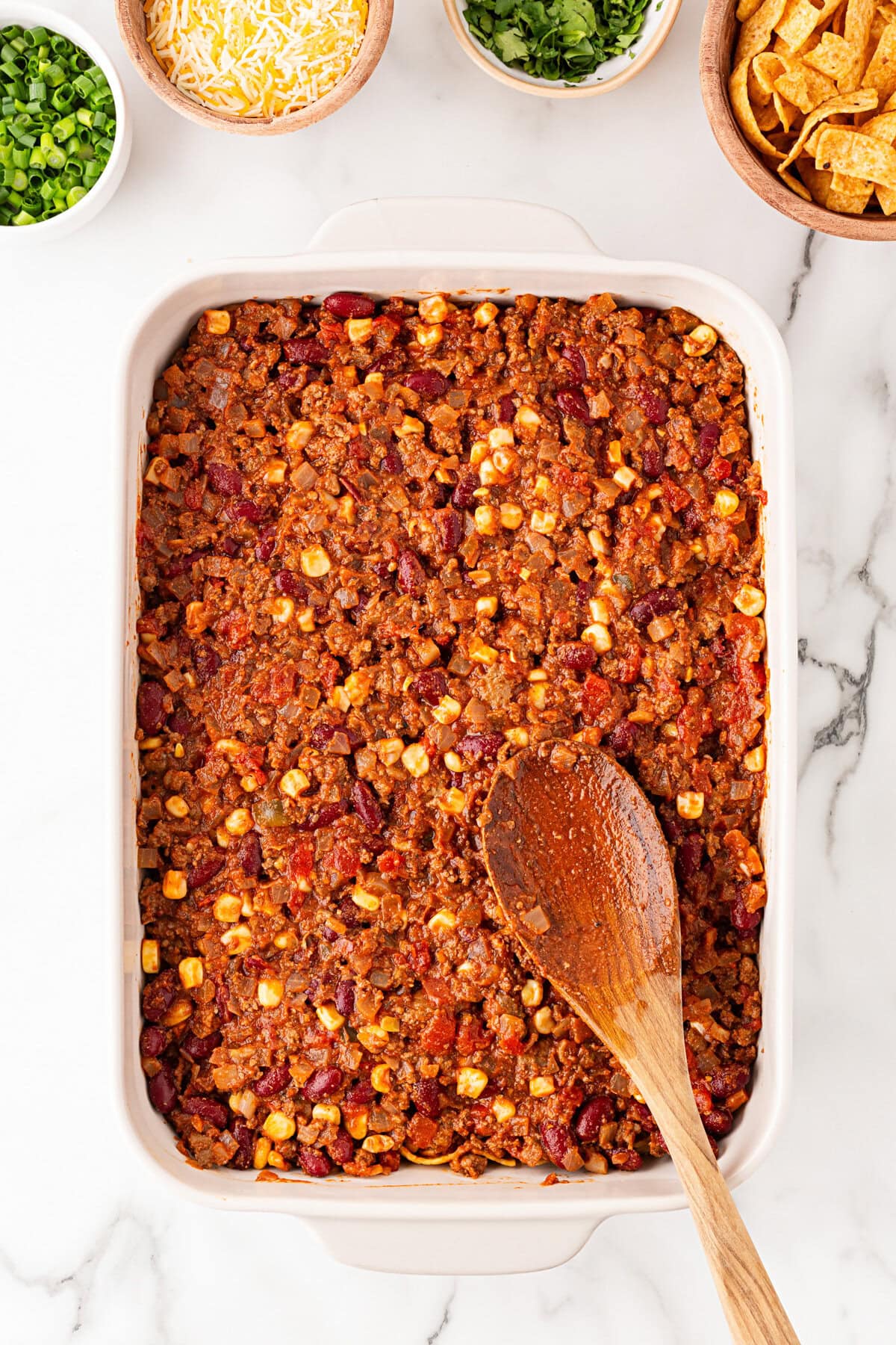 Beef mixture spooned into the baking dish.