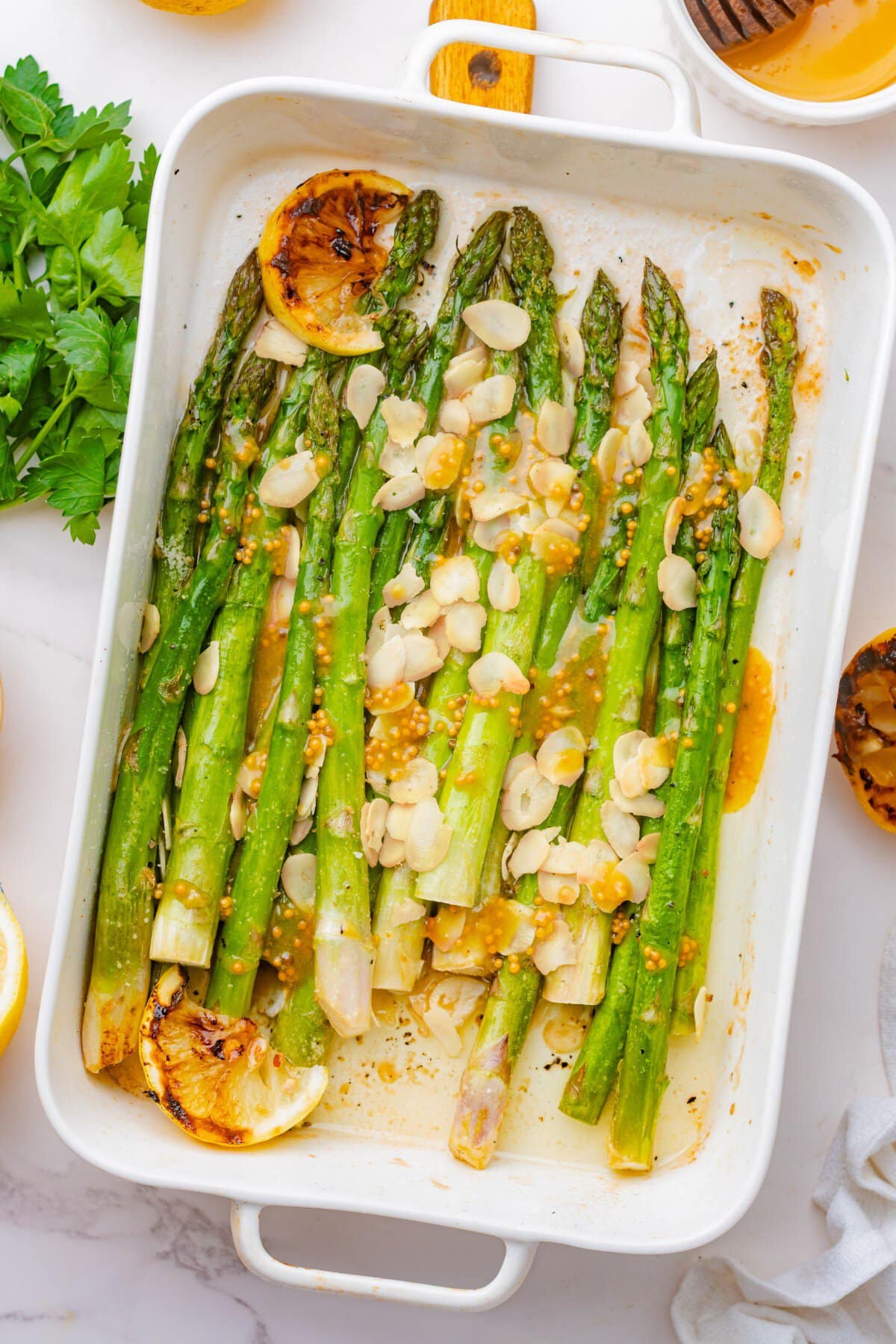 Finished roasted asparagus in a casserole dish. 