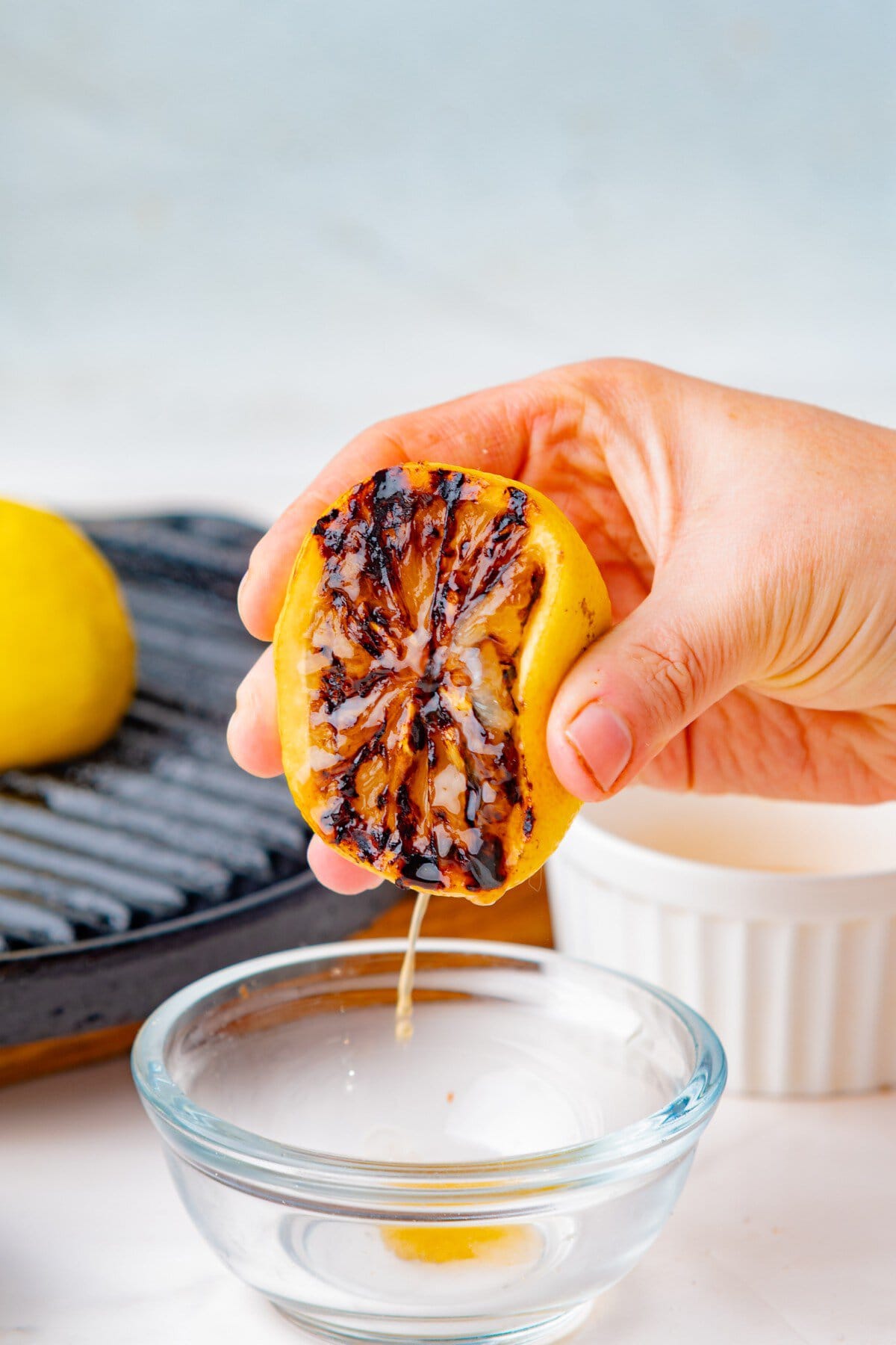 Squeezing a grilled lemon. 