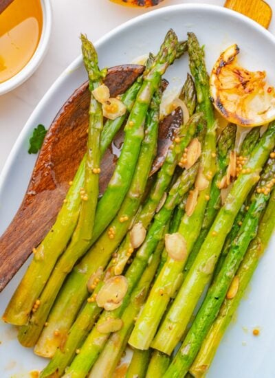 On a plate with a wooden spoon.