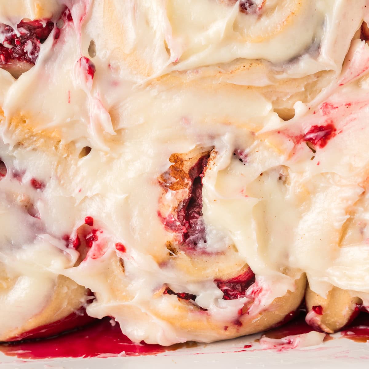 Close-up of Raspberry Cinnamon Rolls.