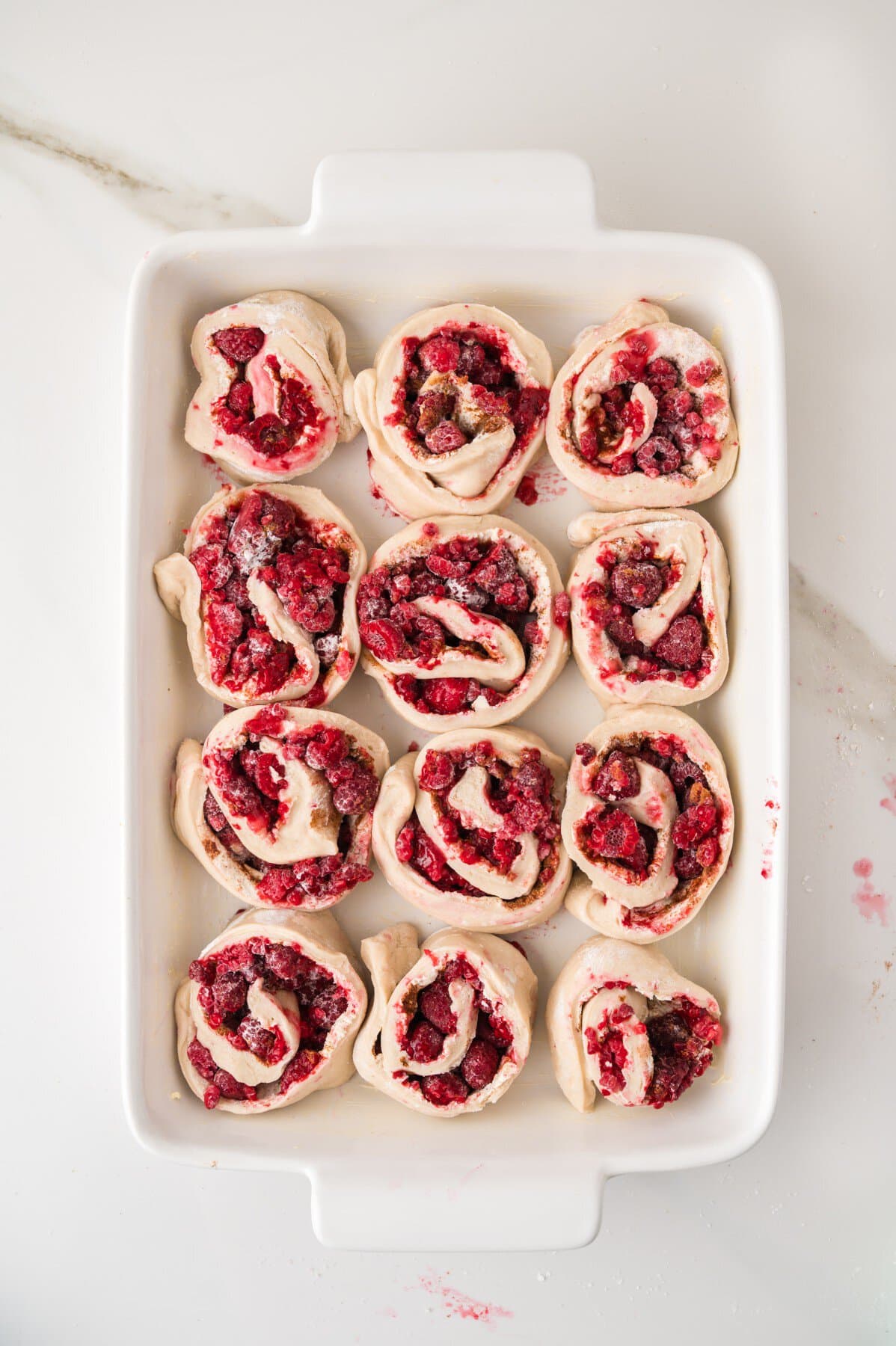 Rolls added to a pan. 
