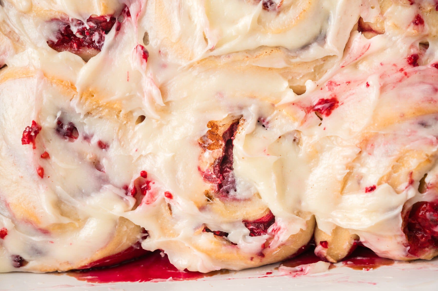 Close-up overhead of Raspberry Cinnamon Rolls. 