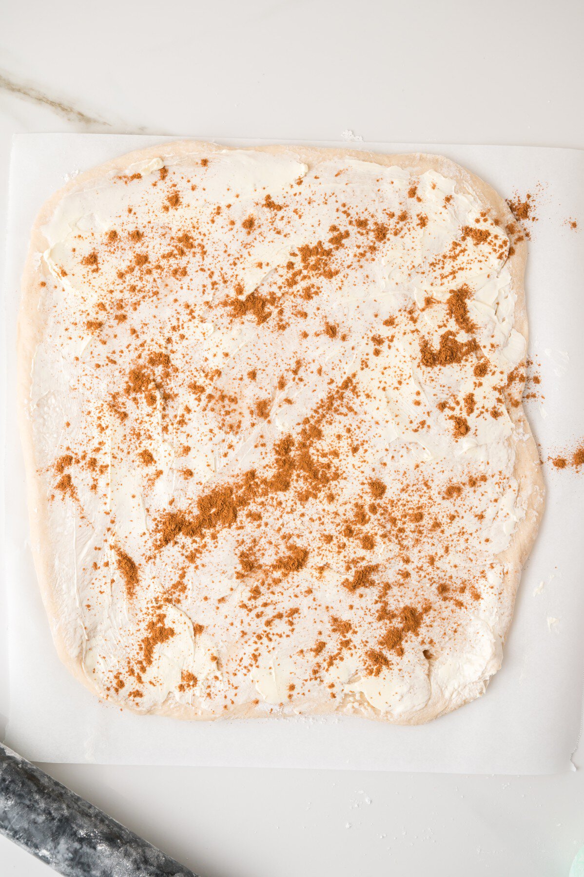 Rolled out and cinnamon added. 