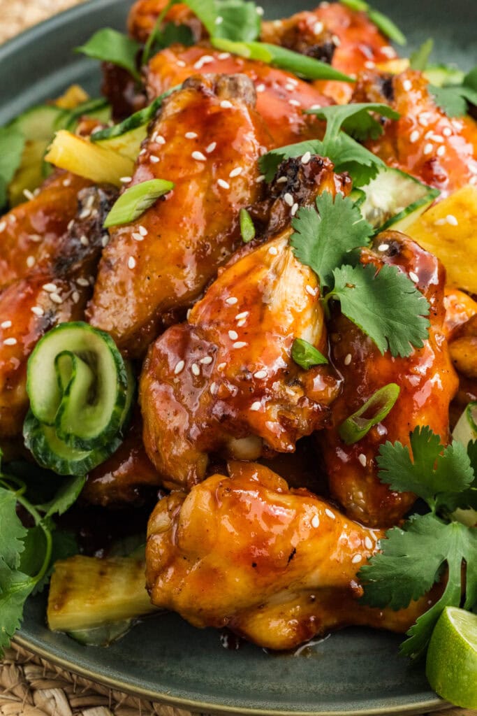 Glazed chicken on a plate.