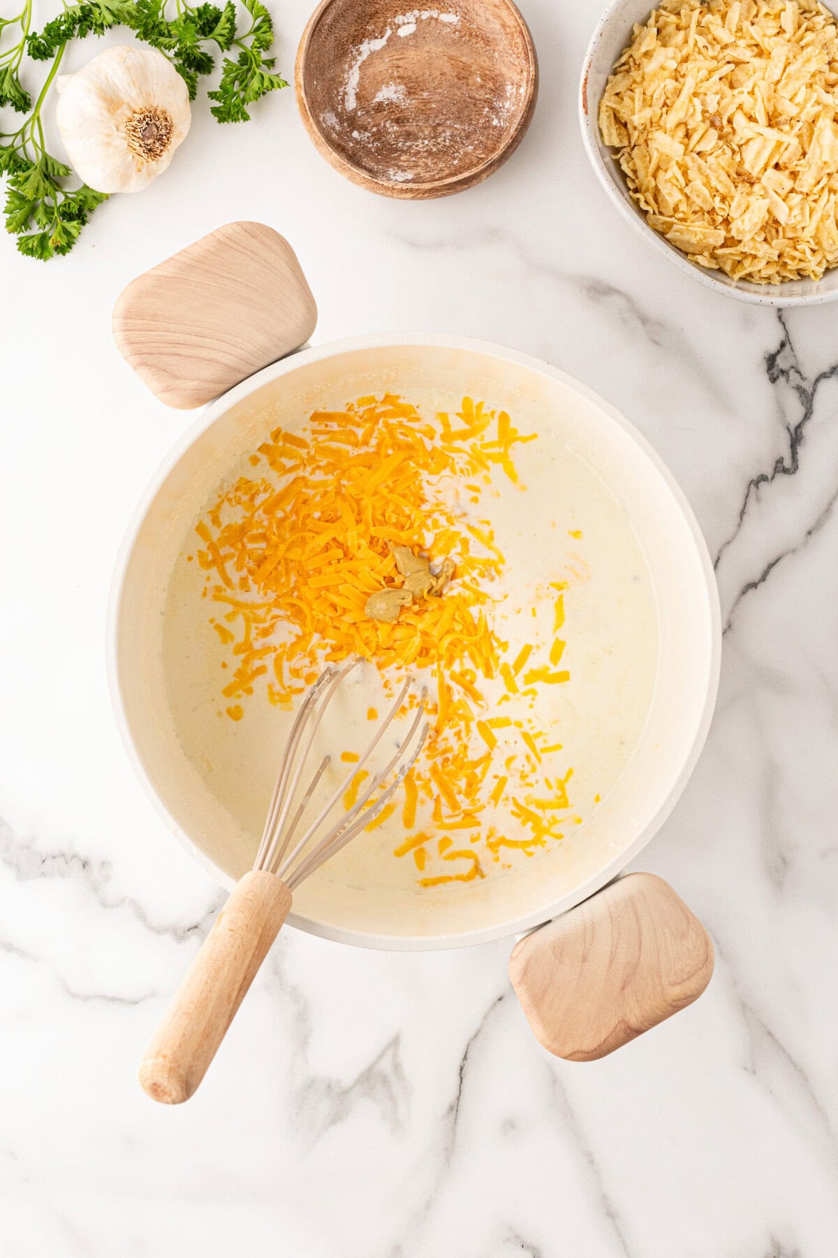 Adding the cheese and mustard. 