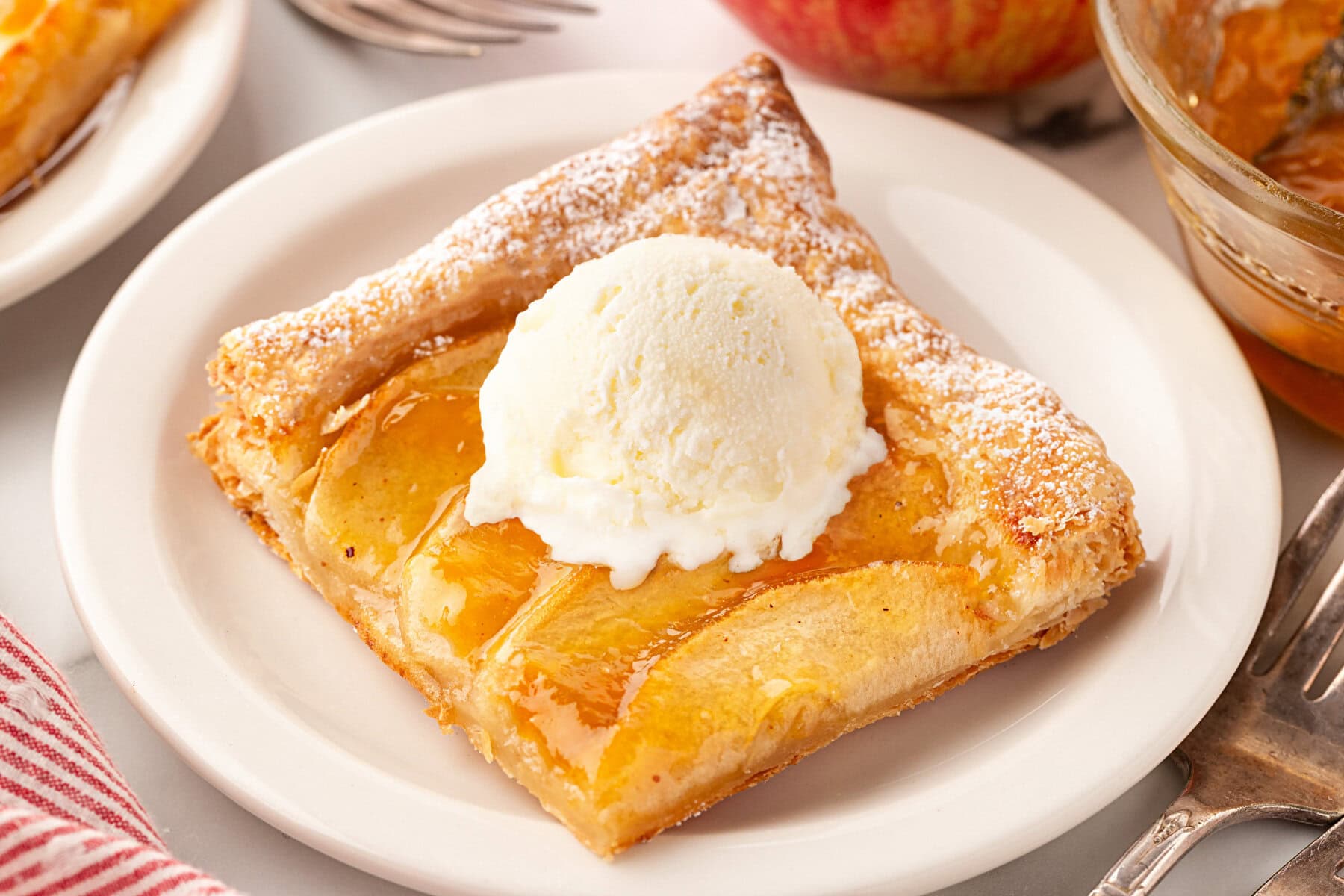 On a plate with ice cream on top.