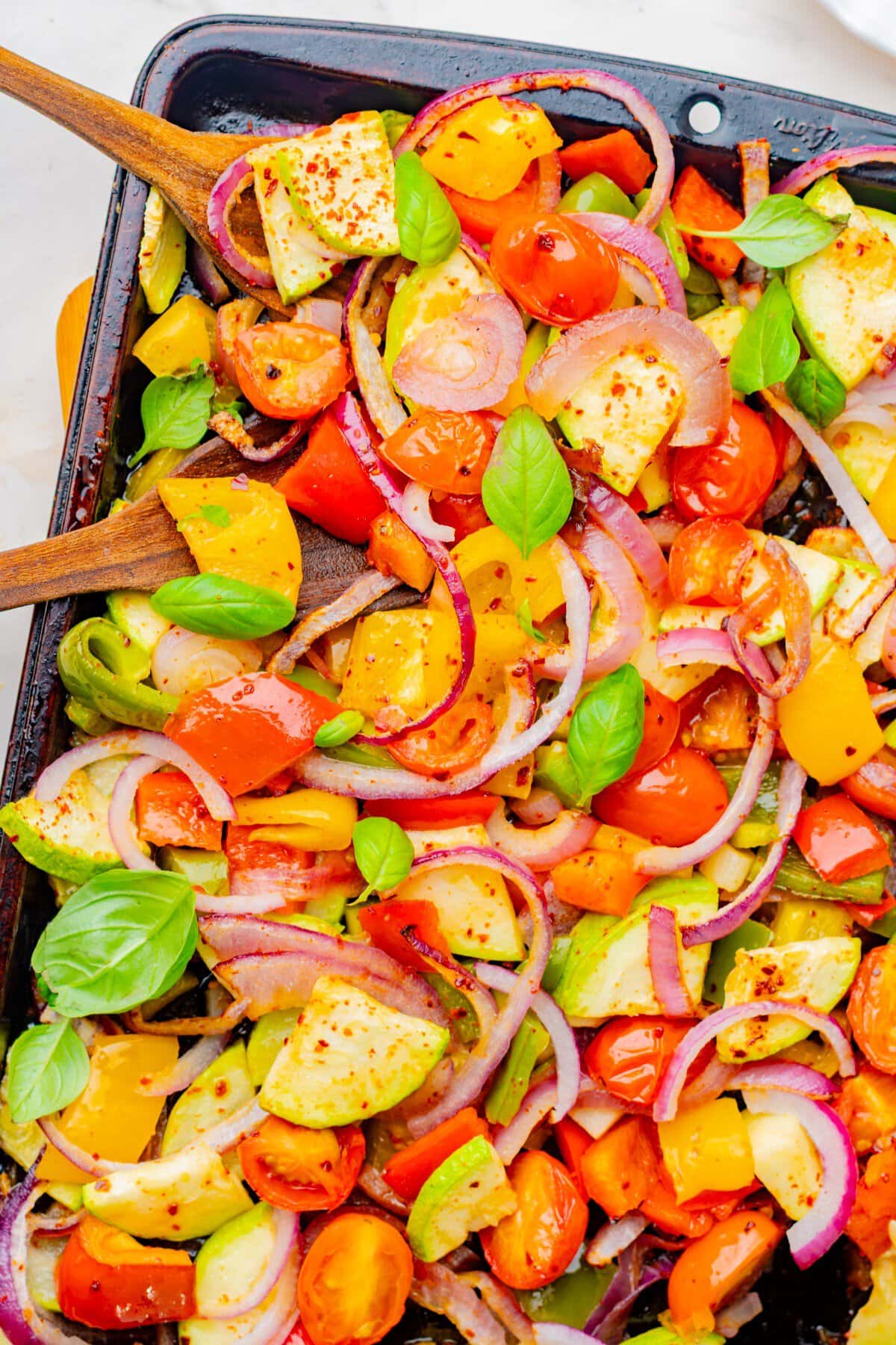 roastred veggies garnished with fresh basil.