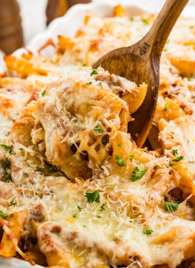 Scooping it from the casserole dish.