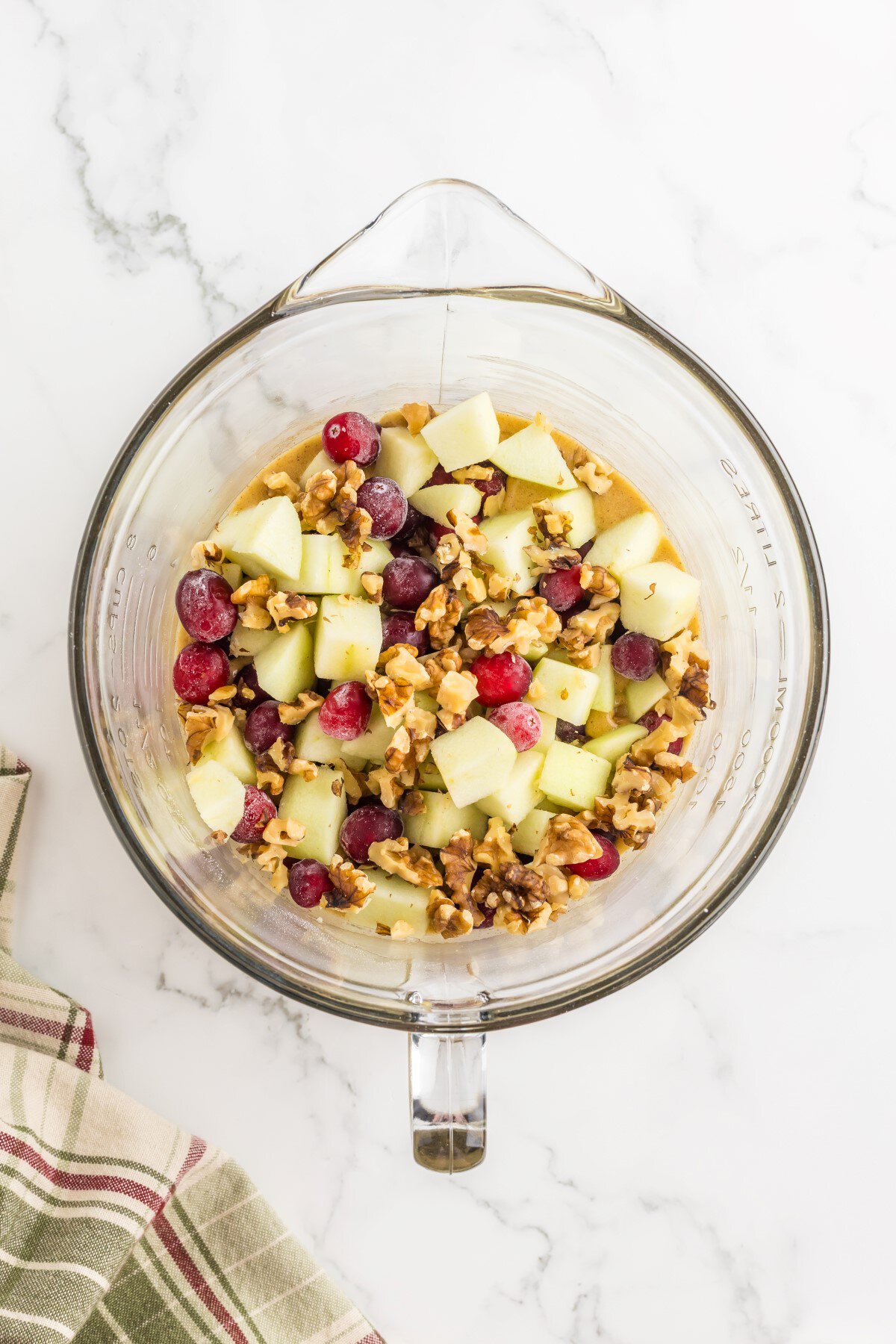 Apples, cranberries, and walnuts added to the batter.