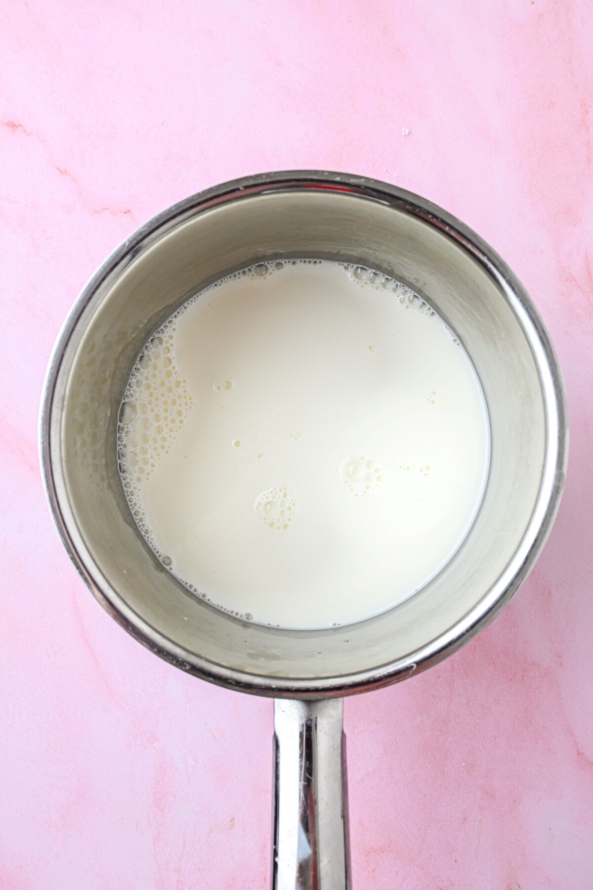 Heating the milk.