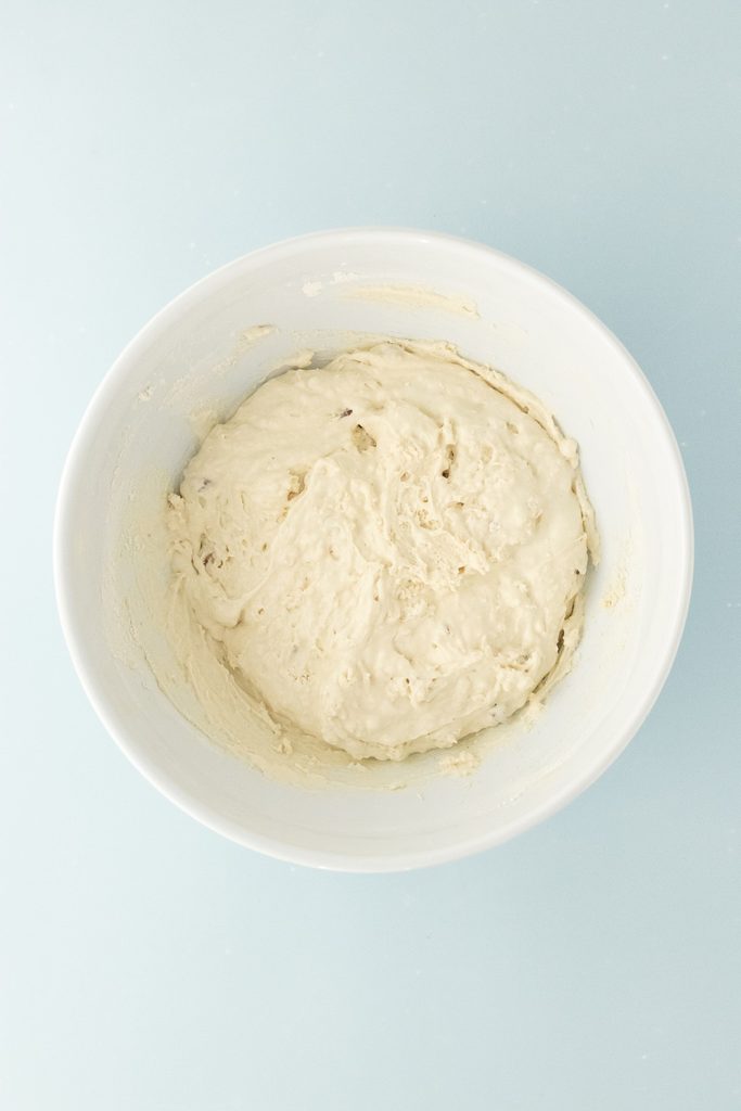 Flour and melted ice cream mixed ina bowl to forma batter.