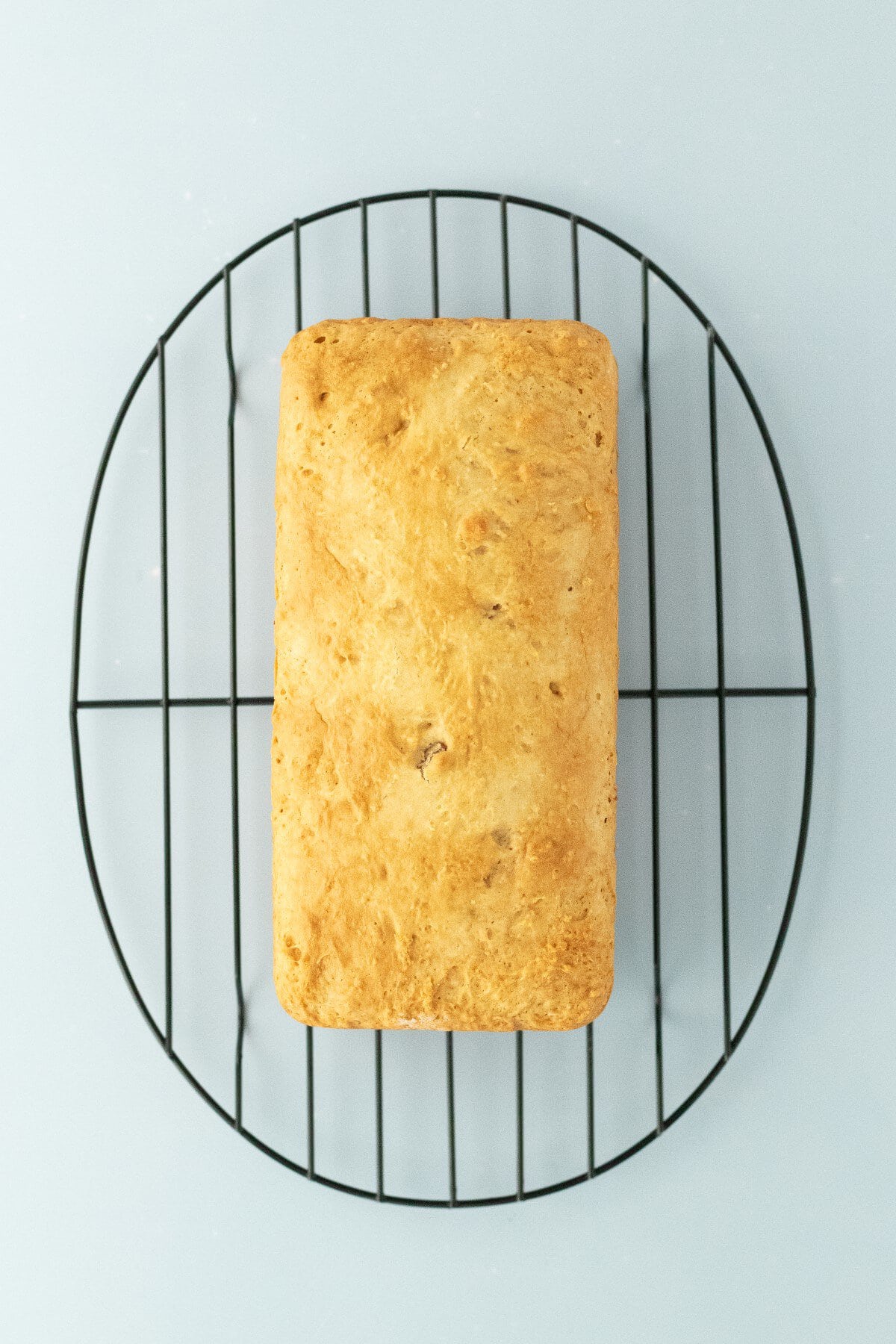 Bread cooling on a wire rack.