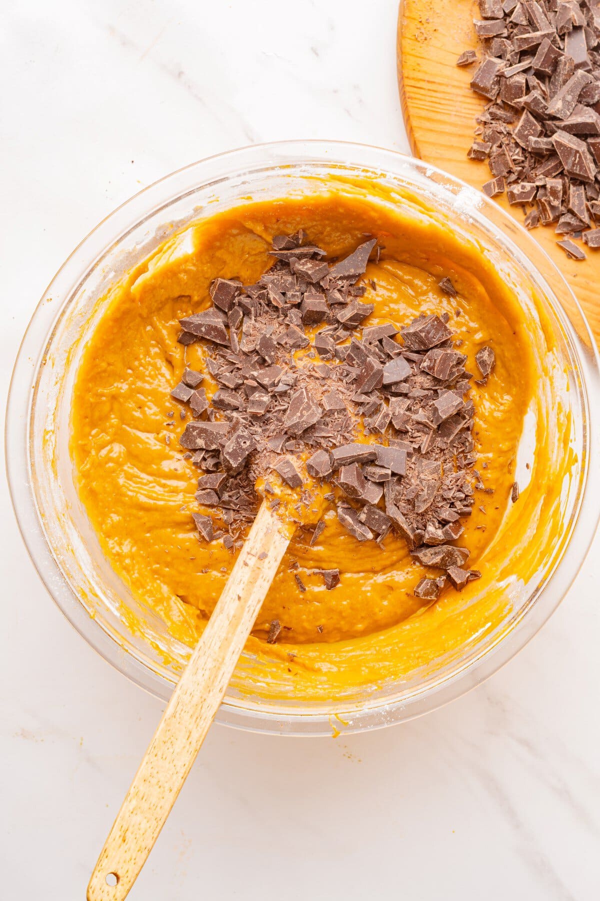 Chocolate chunks added to the batter.