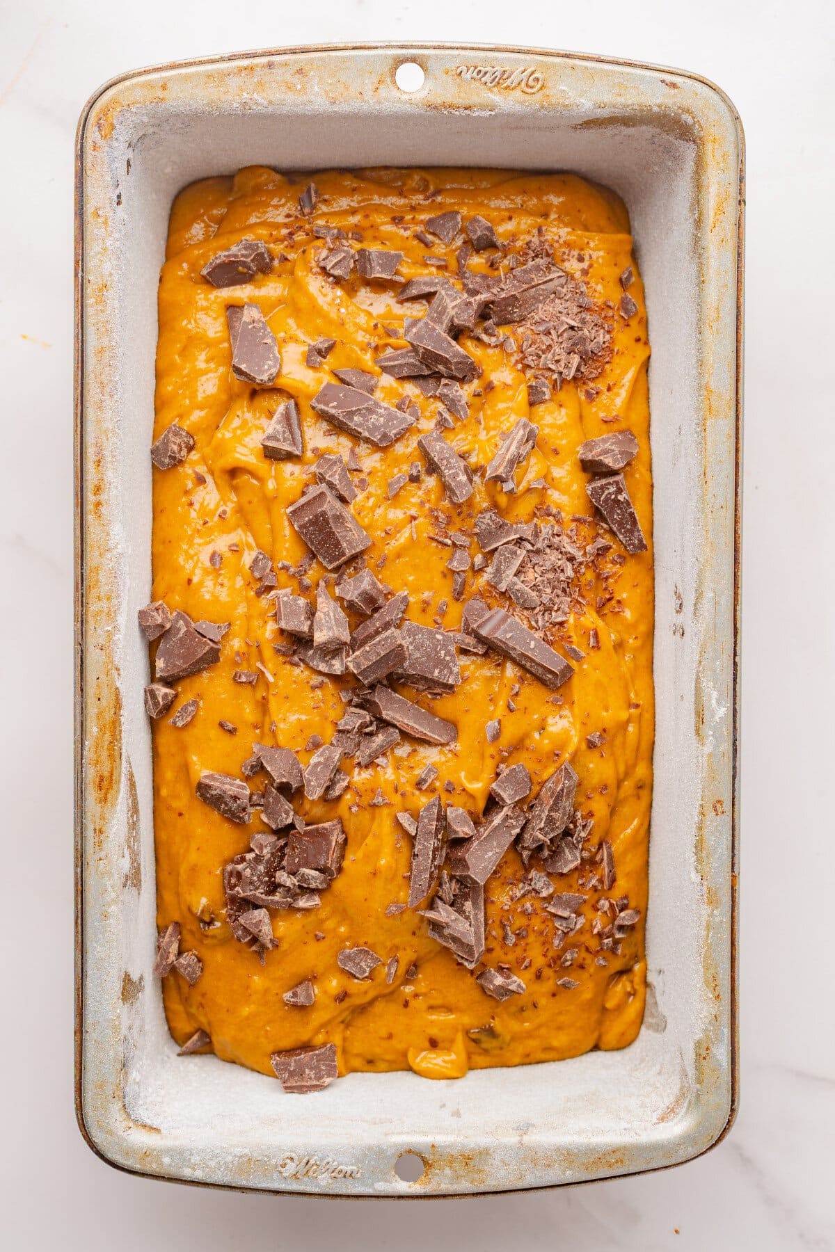 Chocolate chunks added to top of loaf.