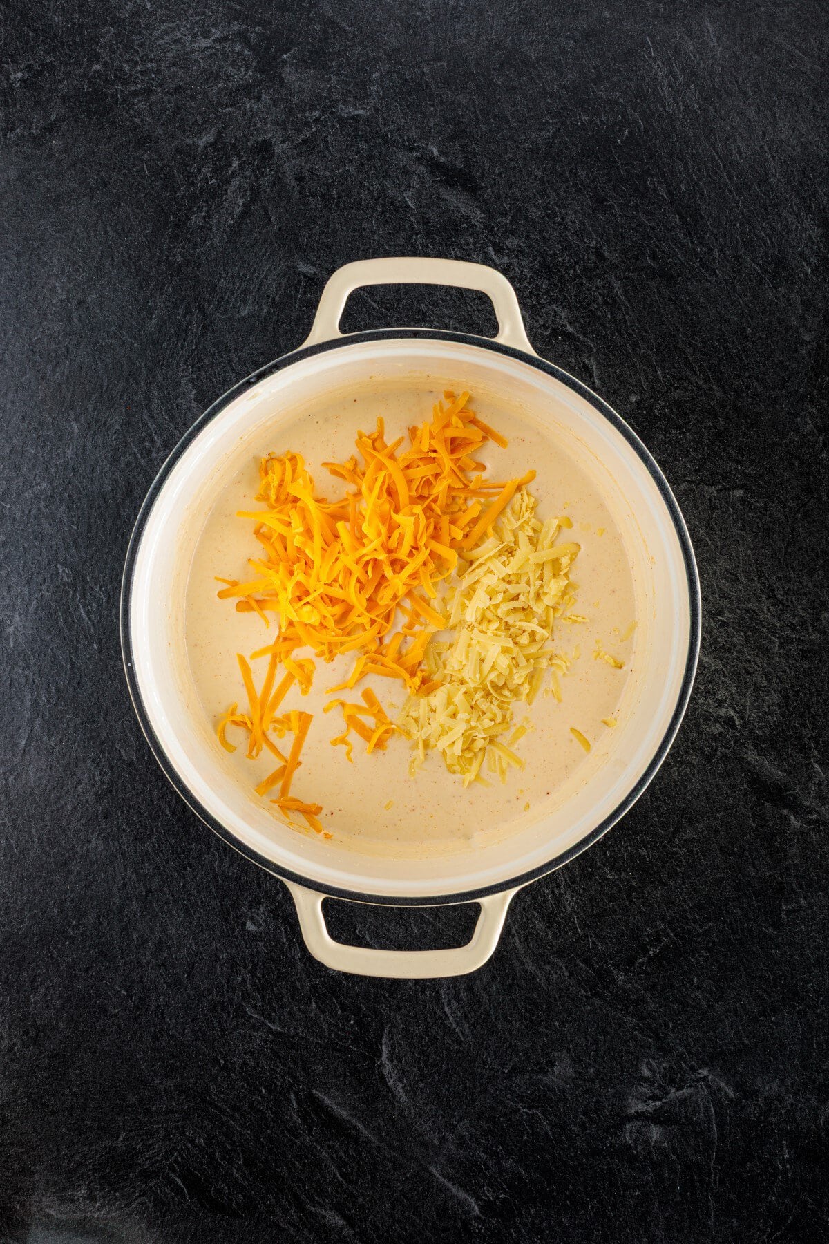 Grated Cheeses added.