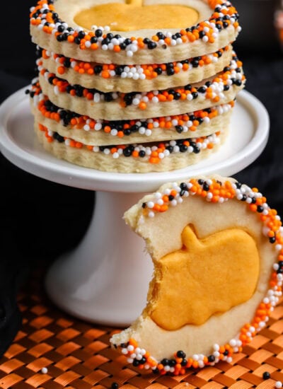 Stacked cookies plus one with a bite taken.